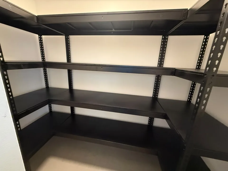 Closer view of a black three-wall installation and open connected corners